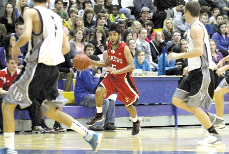 The Chestermere Lakers&#8217; Yuvraj Hundal moves the ball up court against Lord Beaverbrook, Dec. 15. The Lakers won 109-48.