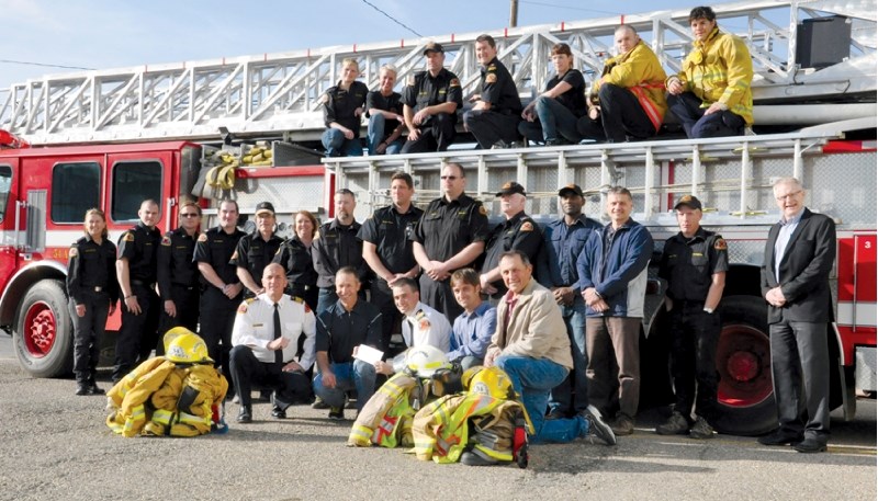 Members of the Crossfield Fire Department received $27,000 from CrossAlta, May 28. The grant will go toward purchasing new turnout gear for the crew.
