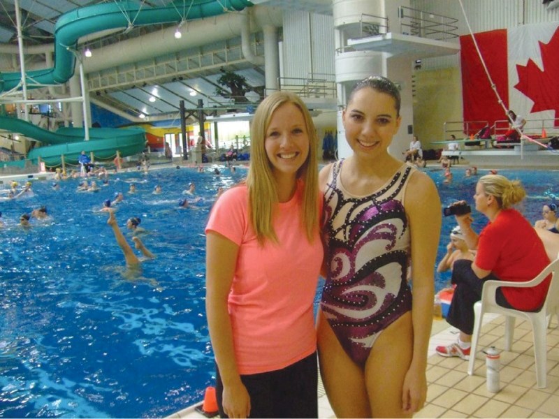 Merissa Redwood (right) of Redwood Meadows poses with her coach, Sarah Dallaire, at the Canadian Open Championships synchronized swimming competition, which was held in