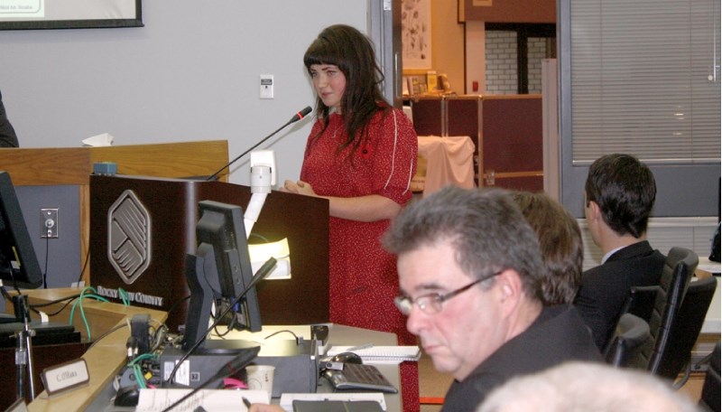 Regina Shakirova speaks to council on the second day of a public hearing for Bingham Crossing, a Springbank development, which ran Oct. 30 and Nov. 1 in council chambers.