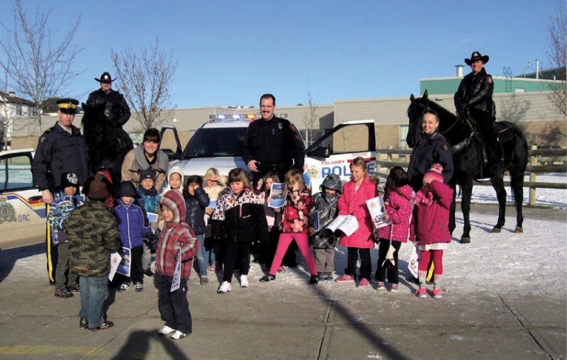Students at Prairie Waters Elementary School in Chestermere got up close and personal with a few a few four legged friends during a recent police visit by local RCMP and the