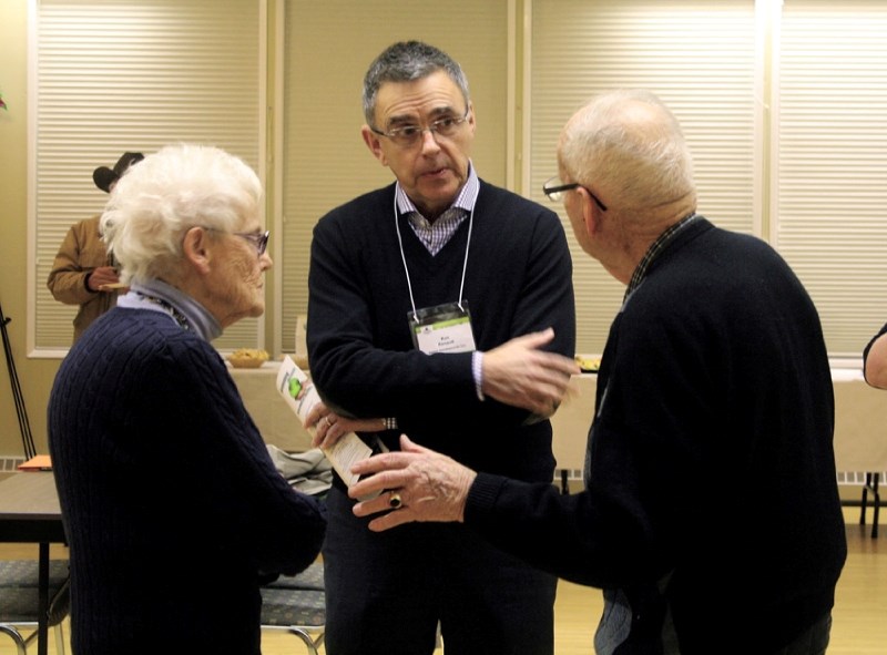 Ron Renaud, developer for Rencour Developments Inc. and Bingham Crossing, speaks with residents during an open house held Jan. 15 at the Springbank Heritage Club. Plans for