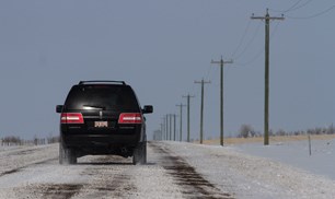 Rural roads have been covered in snow and ice after recent snowfalls. Drivers are reminded to take it easy on the slick conditions. This range road, east of Airdrie, begins