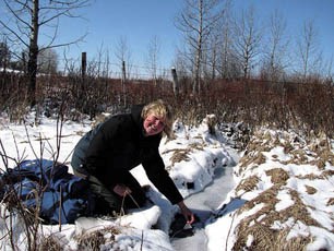 Sandi Riemersma, takes a sample from Upper Horse Creek last year. A fisheries assessment of the upper and lower creek revealed three types of trout in the water.