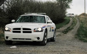 RCMP attend the scene where human remains were found May 14 southeast of Langdon. Results from an autopsy were still pending as of press time.