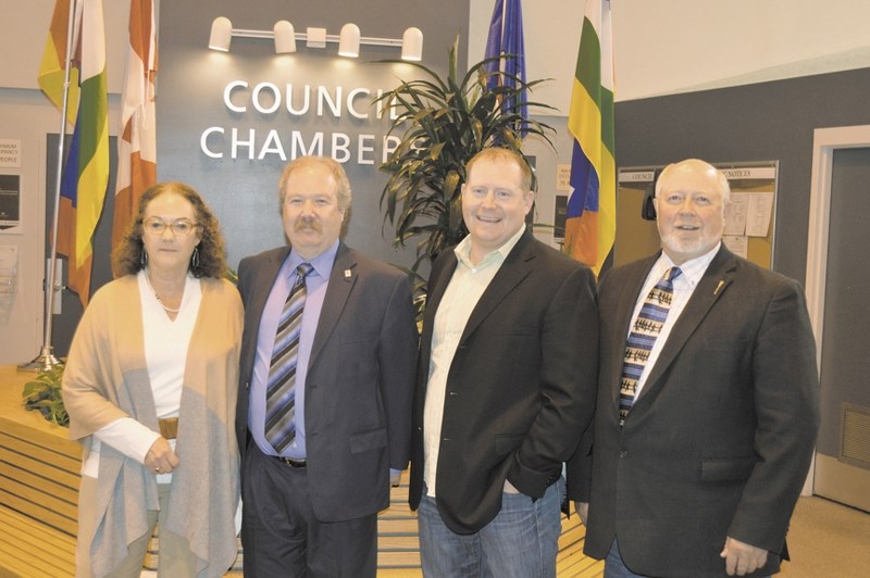 Councillor Liz Breakey, Reeve Rolly Ashdown, Associate Minister for Recovery and Reconstruction of Southwest Alberta Kyle Fawcett and MLA for Banff-Cochrane Ron Casey were