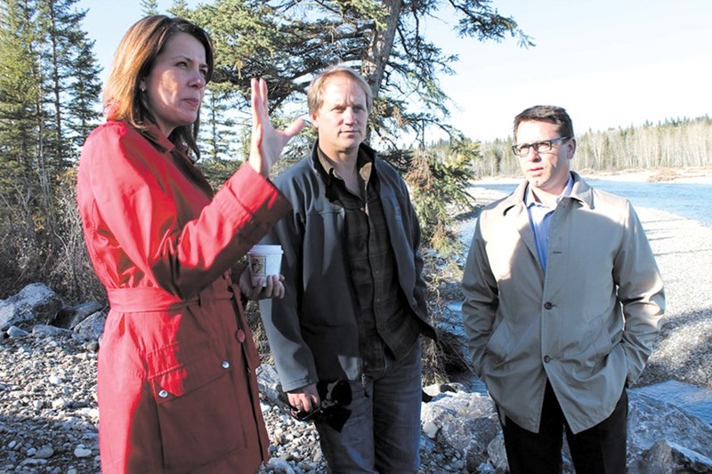 Wildrose leader Danielle Smith and Chestermere-Rocky View MLA Bruce McAllister tour the Redwood Meadows berm with townsite Mayor John Welsh on Oct. 18. Redwood Meadows,
