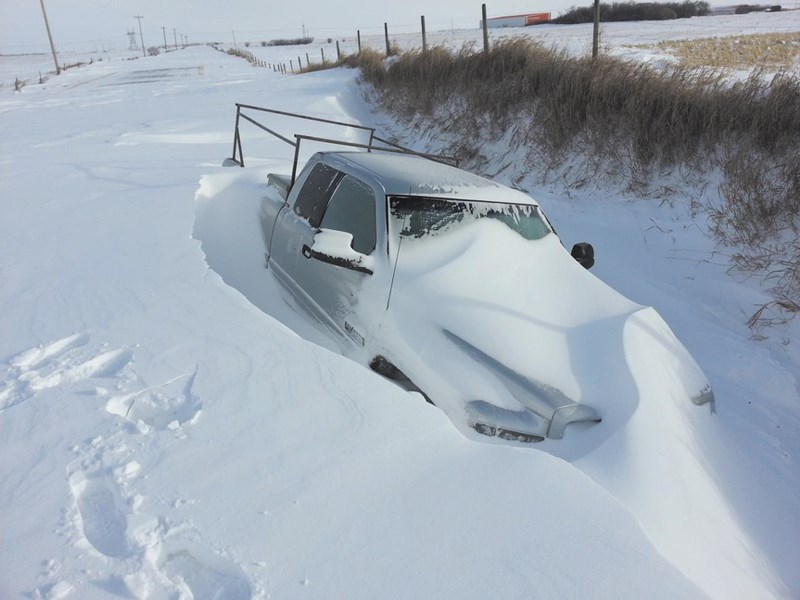 Vehicles stuck in snow on the side of the highway were a common sight after a Dec. 2 and 3 snowstorm dropped up to 20 centimetres in southern Alberta. Communities across the