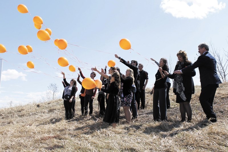 Friends of Jordan Kalinchuk, a 23-year-old volunteer firefighter who died after a bicycle accident in Canmore, gathered at Mitford Pond May 8 to remember the St. Timothy High 