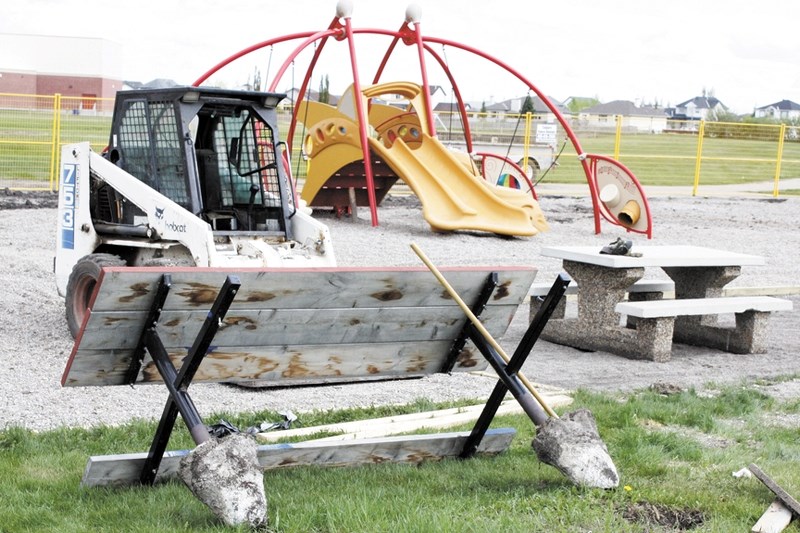 An overturned table, broken bobcat window and some minor damage to the Langdon Field playground won&#8217;t deter volunteers from finishing the project.