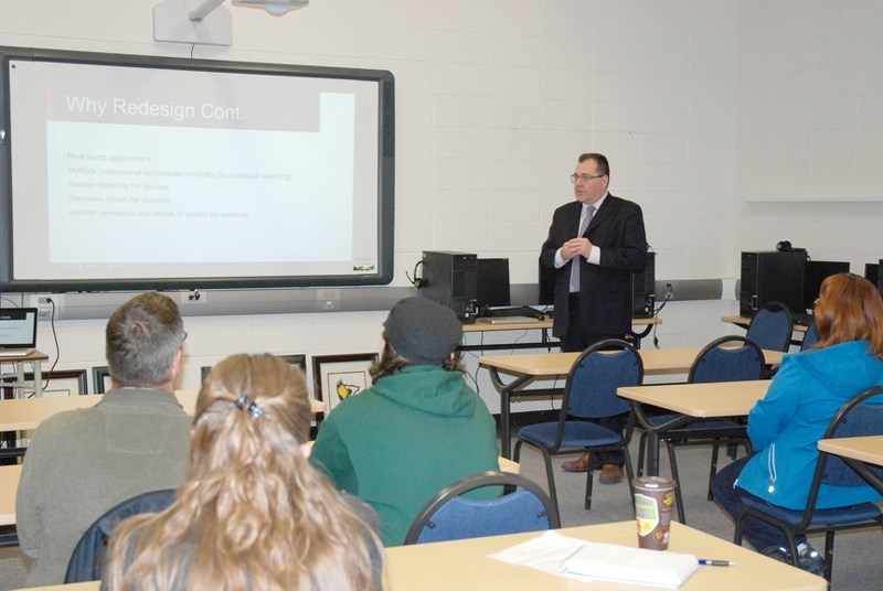 W.G. Murdoch School Principal Garry Bell takes parents through the high school redesign plan on May 28 at the school. The redesign, to be implemented at the Crossfield school 