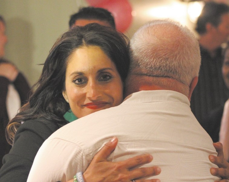 Leela Aheer hugged Campaign Manager Patrick Bergen and thanked supporters while she waited for election results on May 5 at Chestermere Landing. Aheer won the