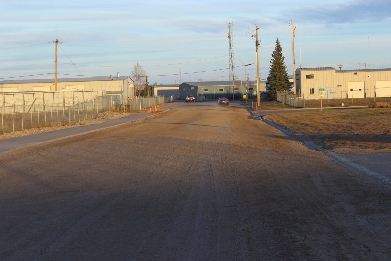 Crossfield&#8217;s Laut Avenue doesn&#8217;t look as shabby as it did in October when this photo was taken. The road has now been paved thanks to a warm weather on Nov. 7.