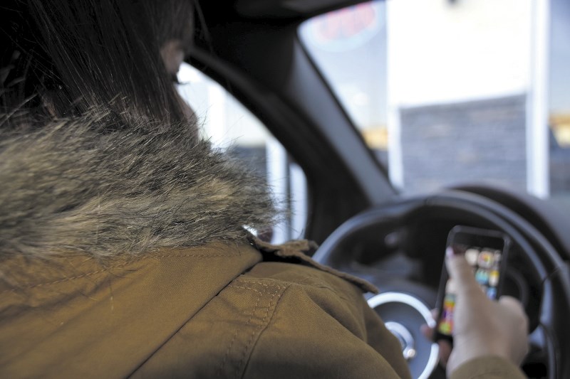 Driving distracted will now cost you three demerit points on top of a $287 fine.