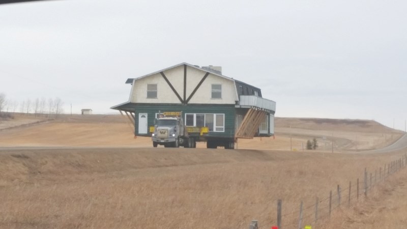 A home that spent the night blocking the road near the Balzac train tracks after the vehicle moving it got hung up on the tracks, was finally moved Feb. 18.
