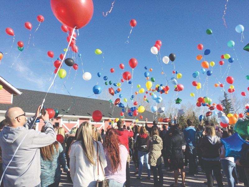 Hundreds gathered in Langdon to release balloons March 29 in memory of Quinton Peplinski, 19. Peplinski was killed in two-vehicle collision March 26.