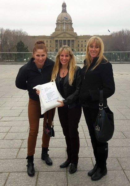 Chestermere residents Judy Dougan, Laurie Bold and Lara Sigurdsen delivered the petition to Municipal Affairs March 24. More than two months later, the Province has