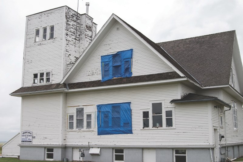 The century-old Irricana United Church was hit hard by hail July 30. Damage included the breaking of stained-glass windows (left) that have been a part of the church as long