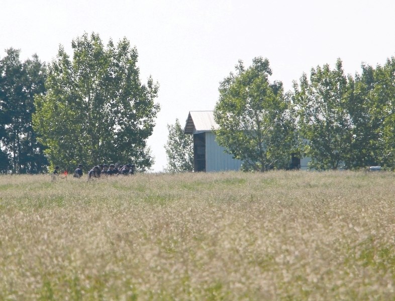 The trial for accused triple-murderer Douglas Garland began in Calgary Jan. 16. It is scheduled for five weeks. Here, officers search the Garland farm in 2014 prior to