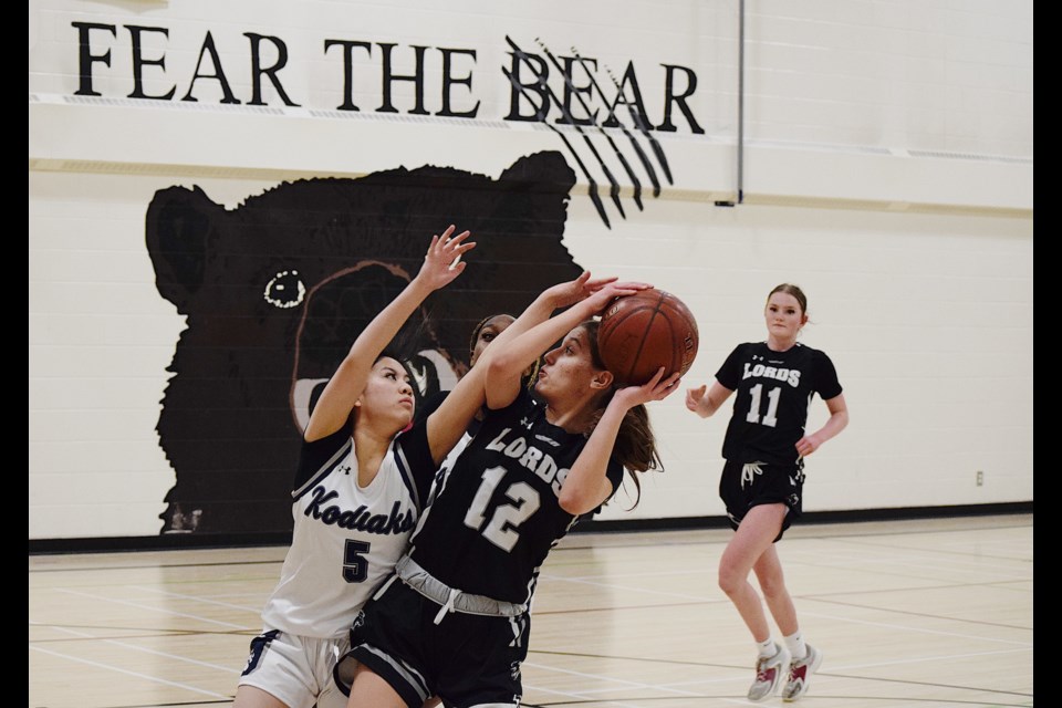 The St. Martin de Porres Kodiaks senior girls team (white) lost to the Lord Beaverbrook Lords 64-51 in the semi-final matchup of the CSHSAA Division 3 basketball playoffs.