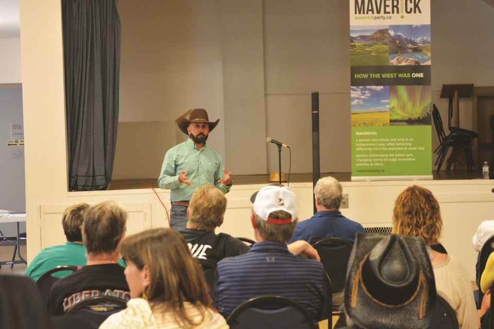 Tariq Elnaga speaks to the audience at a town hall event on July 13 in Balzac. Elnaga is running as a candidate for the Maverick Party to represent the Banff-Airdrie federal constituency.