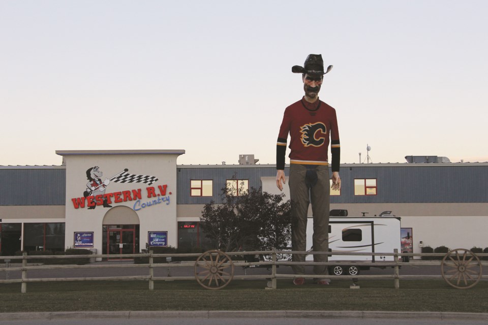 Western Wayne, an iconic figure in Airdrie, stands tall outside of Western R.V. on Sept. 27. Photo by Carmen Cundy/Airdrie City View