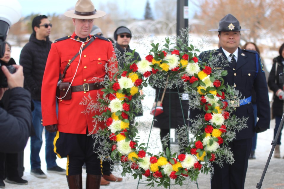 Colour guard from RCMP and Alberta Sheriffs help bring in the wreath to honour Dr. Jose Rizal at the Rizal monument in Airdrie's Nose Creek Regional Park on Dec. 30.