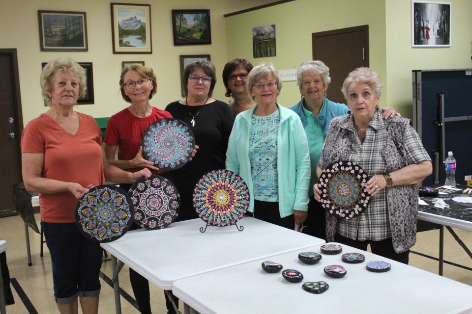 Airdrie Over 50 Club takes part in mandala stone painting session at the Town and Country Centre on Sept. 21. Club members pictured (from left) Phyllis Pitz, Jo-Anne Jagers, Theresa Mattoon, Betty Turk, Sonja McKee, Jean MacDougall and Sharon Mudge.