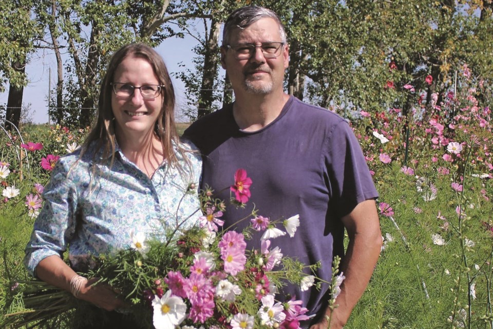 Local farmers market vendors Kathy and David Lowther who own and operate Petal & Pollen recently won the 2021 Outstanding New Vendor award by the Alberta Farmers' Market Association.