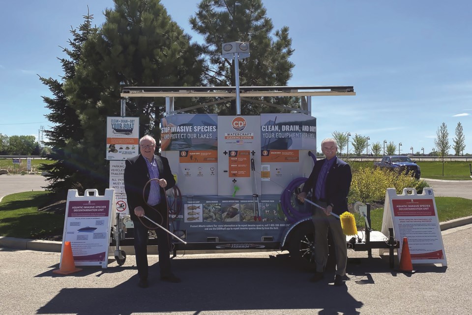 Mayor Marshall Chalmers (right) and Western Irrigation Disctrict Board Chair Dan Shute are excited about Chestermere's new user-operated boat-cleaning technology. 