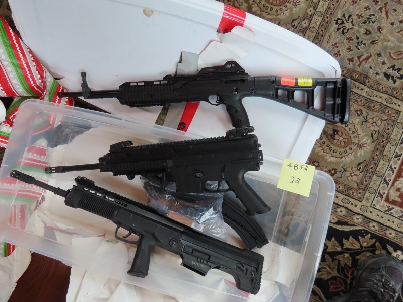 Weapons seized in Calgary police search of three residences in Calgary and Bearspaw.