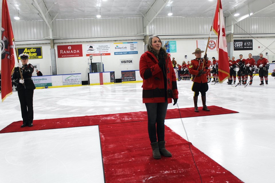 Deputy mayor Tina Petrow did double duty singing the national anthem and presiding over the ceremonial face off during the game.