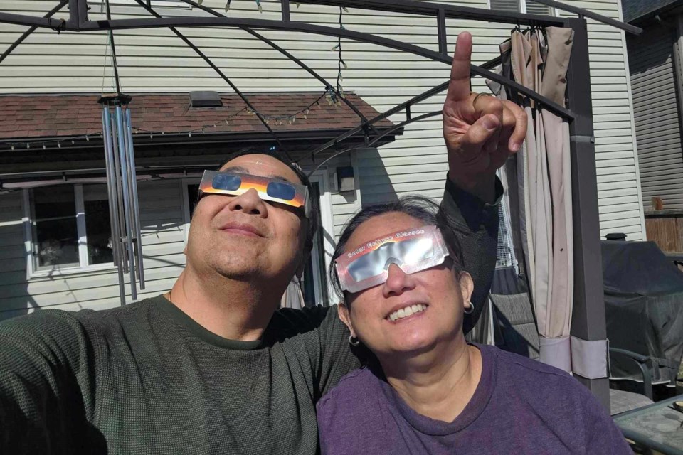 Sabi & Atet Mabanta watched the partial solar eclipse on April 8 from Airdrie's Canals neighbourhood.