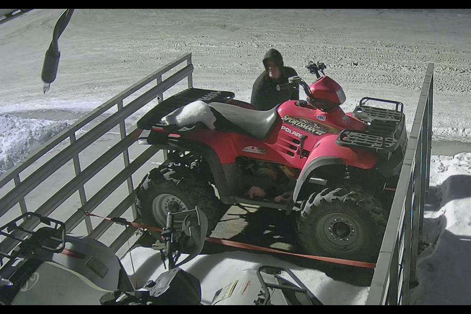 Airdrie RCMP seeking male suspect and blue pickup truck for Kings Heights ATV/Trailer theft.