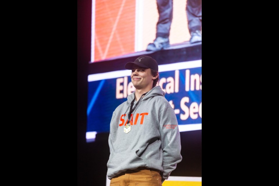 Bert Church High alumnus Erik Thoresen stood proudly on podium to claim his gold medal for electrical installation at the 2023 Skills Canada Alberta competition. He finished second in this year's competition.