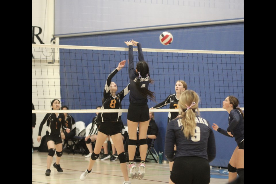 A St. Martin de Porres Kodiaks player goes up for a block during one of the Airdrie team's matches at the Kodiak Klassik tournament on Oct. 15.