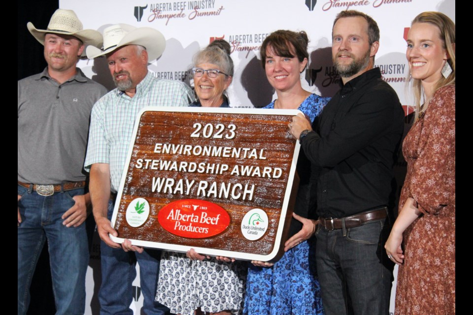 The Wray family, (Doug, Linda, Joanne and Tim), receives the 2023 Environmental Stewardship Award at the Alberta Beef Producers "Stampede Summit" on July 10 in Calgary.