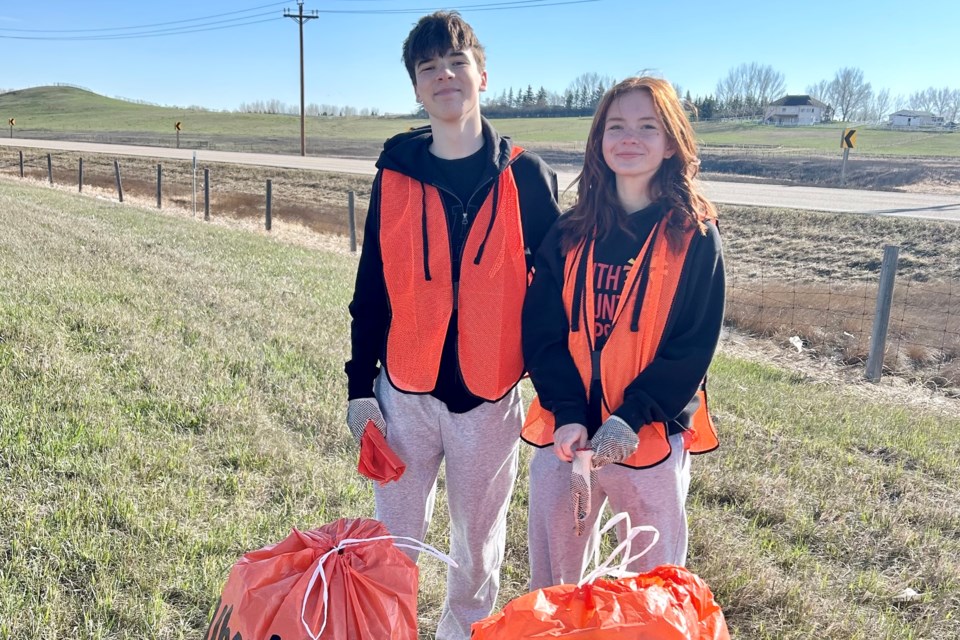 Volunteers of the Youth Volunteer Corps cleaning up the highway.