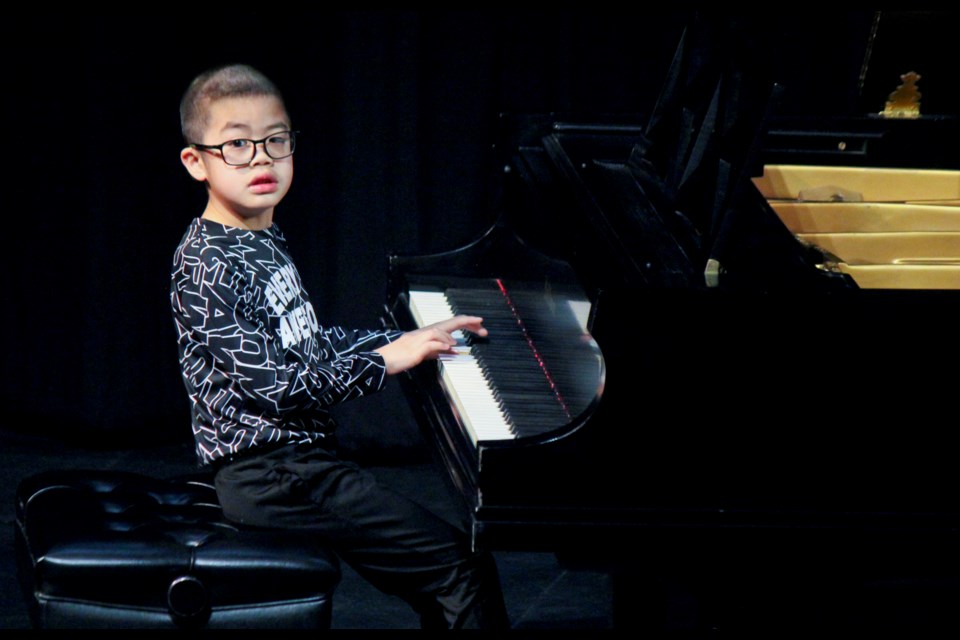 Precocious young Kevin Nguyen performs 'Seven of Hearts' during the Grade 8 20th Century piano class at the 2022 Peace River North Festival of the Arts.