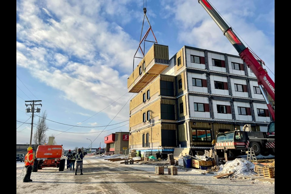 Crews lift the last modular unit for the new Salvation Army supportive housing complex into place Friday afternoon, Nov. 19, 2021.