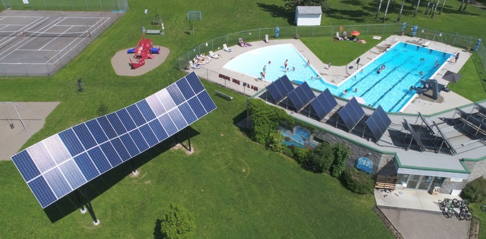 The Hudson’s Hope outdoor pool is heated by solar collectors on the roof, and powered by the “Solar Wave” at left. Designed, supplied and installed by Peace Energy Cooperative, The Wave provides more than 10,000 watts of electricity, but also much-needed shade, plus a unique architectural feature and tourist attraction for the community.
