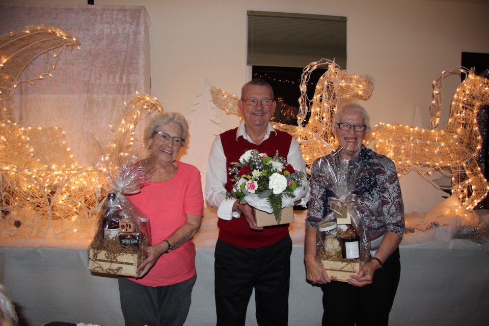 Lil Kocher, Dorothy Burkholder, and Harry Halladay were the door prize winners at the 2022 seniors supper and dance.