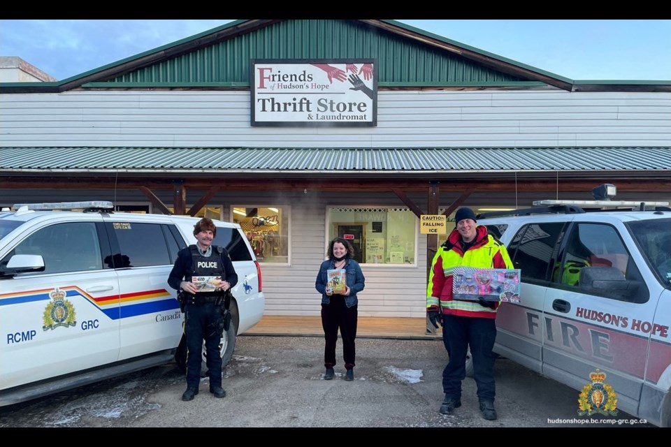 Hudson’s Hope RCMP Cpl. Rob Gardner and Fire Chief Brad Milton with Lynnea Stacey from the Friends of Hudson’s Hope during the 2021 drive. 