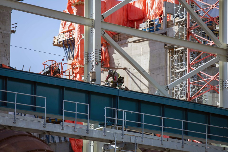 Crews install a crane rail in the powerhouse, February 2021.