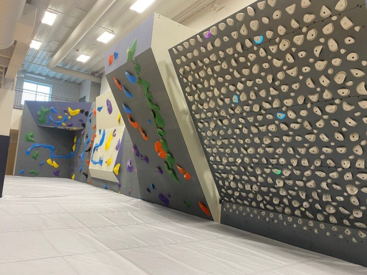 An indoor rock-climbing wall among amenities at Cedar Valley Lodge.