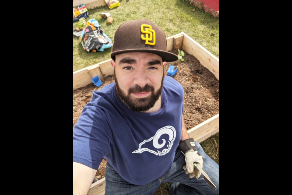 Hopeful gardener Dillon Giancola in happier times, planting his plot at the FSJ Community Gardens on May 15, 2021.