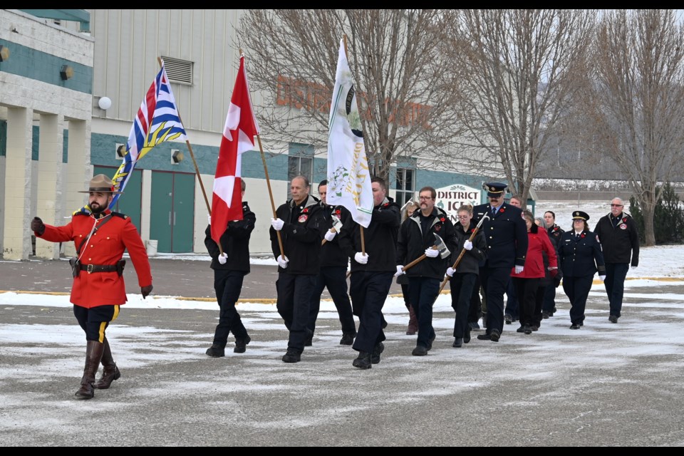 Remembrance Day services began with the colour guard procession from the arena to the community hall.