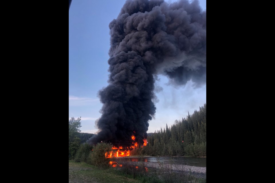 A fuel tanker truck crashed and caught fire on the Sikanni bridge, about two hours north of Fort St. John on the Alaska Highway, Aug. 25, 2022. (Submitted)