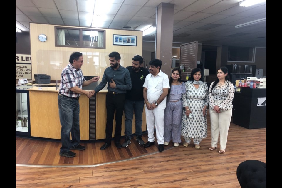 Mah hands over keys to Ankush Kalra after 40 plus years running the store, and 60 plus in the community.