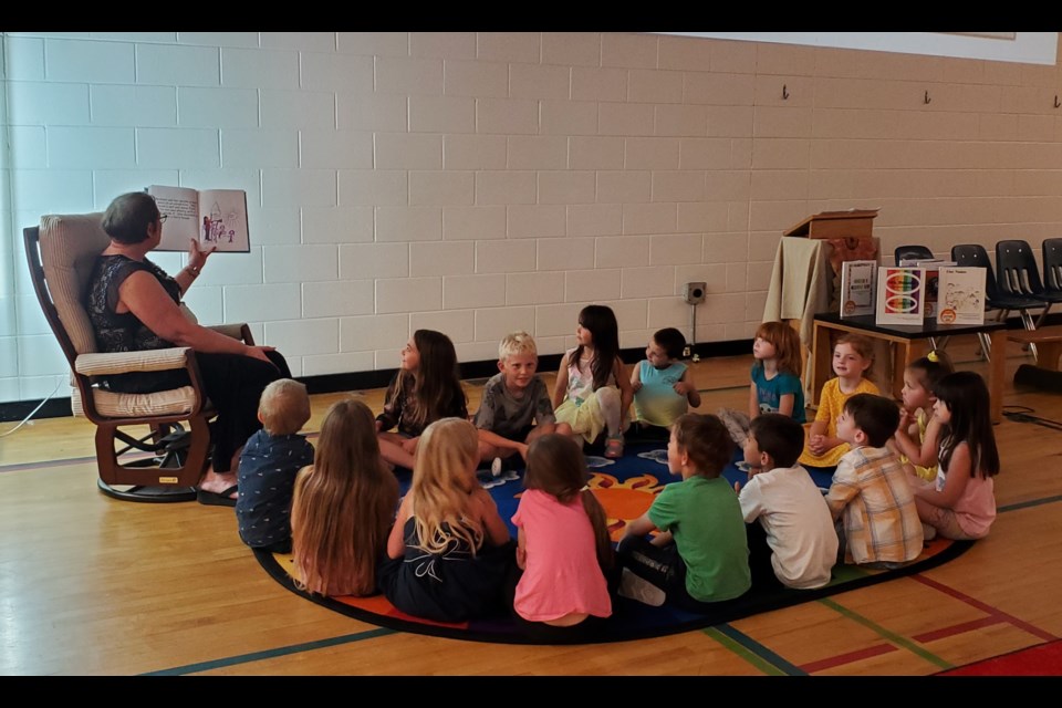 A story about a purple crayon by the students is read. 